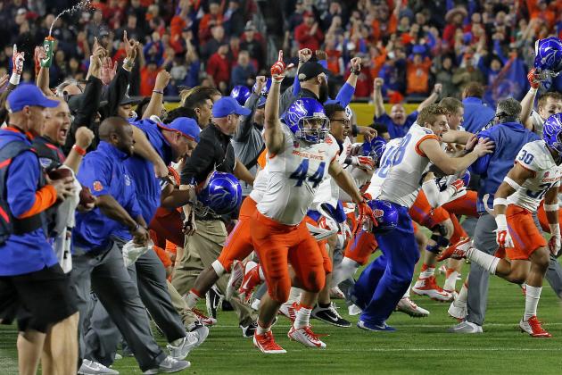 Boise State players run on the field as time expires in the Fiesta Bowl NCAA college football game against Arizona, Wednesday, Dec. 31, 2014, in Glendale, Ariz. Boise State won 38-30. (AP Photo/Matt York)