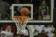 The basketball goes into the hoop during an NCAA college basketball game between Gonzaga andTennessee, Saturday, Dec. 19, 2015, in Seattle. Gonzaga beat Tennessee 86-79. (AP Photo/Ted S. Warren)