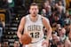 BOSTON, MA - DECEMBER 18: David Lee #42 of the Boston Celtics handles the ball during the game against the Atlanta Hawks on December 18, 2015 at the TD Garden in Boston, Massachusetts. NOTE TO USER: User expressly acknowledges and agrees that, by downloading and or using this photograph, User is consenting to the terms and conditions of the Getty Images License Agreement. Mandatory Copyright Notice: Copyright 2015 NBAE (Photo by Brian Babineau/NBAE via Getty Images)