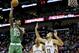 Dec 7, 2015; New Orleans, LA, USA; Boston Celtics forward Amir Johnson (90) shoots over New Orleans Pelicans forward Ryan Anderson (33) and center Alexis Ajinca (42) during the second half of a game at the Smoothie King Center. The Celtics defeated the Pelicans 111-93. Mandatory Credit: Derick E. Hingle-USA TODAY Sports