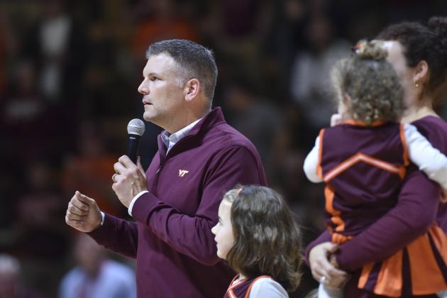 Dec 1, 2015; Blacksburg, VA, USA; The new Virginia Tech Hokies head football coach Justin Fuente (L) speaks to the fans during halftime against the Northwestern Wildcats at Cassell Coliseum. The Wildcats won 81-79. Mandatory Credit: Michael Shroyer-USA TODAY Sports