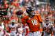 Denver Broncos quarterback Peyton Manning (18) throws the football to the sidelines for transport to the Hall of Fame after setting the new passing record against the Kansas City Chiefs during the first half of an NFL football game against the, Sunday, Nov. 15, 2015, in Denver. Manning moved into first place for all-time passing yards, passing Brett Favre's record of 71,838. (AP Photo/Jack Dempsey)