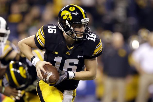 Iowa quarterback C.J. Beathard (16) looks to hand the ball off during the first half of the Big Ten Conference championship NCAA college football game against Michigan State Saturday, Dec. 5, 2015, in Indianapolis. (AP Photo/Michael Conroy)