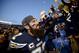 San Diego Chargers free safety Eric Weddle signs autographs after their win against the Miami Dolphins in an NFL football game Sunday, Dec. 20, 2015, in San Diego (AP Photo/Denis Poroy)