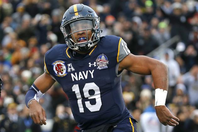 Navy quarterback Keenan Reynolds reacts after scoring a touchdown in the first half of the Military Bowl NCAA college football game against Pittsburgh, Monday, Dec. 28, 2015, in College Park, Md. (AP Photo/Patrick Semansky)