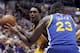 Los Angeles Lakers guard Lou Williams, left, is fouled by Golden State Warriors forward Draymond Green (23) during the second half of an NBA preseason basketball game in Anaheim, Calif., Thursday, Oct. 22, 2015. The Warriors won 136-97. (AP Photo/Alex Gallardo)
