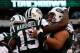 EAST RUTHERFORD, NJ - DECEMBER 27: Brandon Marshall #15 of the New York Jets celebrates with his teammates after scoring a touchdown in the second quarter against the New England Patriots during their game at MetLife Stadium on December 27, 2015 in East Rutherford, New Jersey. (Photo by Jeff Zelevansky/Getty Images)