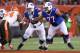 Buffalo Bills tackle Cordy Glenn (77) and Richie Incognito (64) against Cleveland Browns defensive tackle Randy Starks (94) in an NFL preseason football game, Thursday, Aug. 20, 2015, in Cleveland. (AP Photo/Ron Schwane)