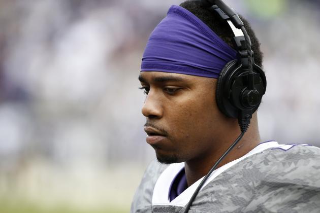 TCU quarterback Trevone Boykin uses headphones on the sidelines against Kansas  in the second half of an NCAA college football game Saturday, Nov. 14, 2015, in Fort Worth, Texas. (AP Photo/Ron Jenkins)