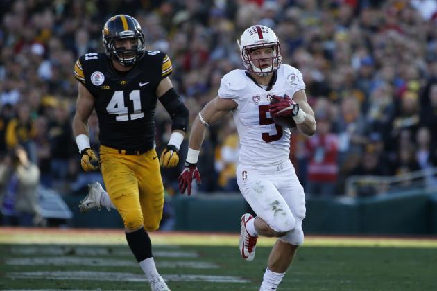 Stanford running back Christian McCaffrey, right, scors past Iowa linebacker Bo Bower during the first half of the Rose Bowl NCAA college football game, Friday, Jan. 1, 2016, in Pasadena, Calif. (AP Photo/Lenny Ignelzi)