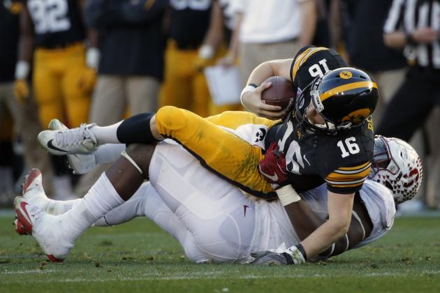 Iowa quarterback C.J. Beathard, right, is sacked by Stanford defensive end Aziz Shittu during the second half of the Rose Bowl NCAA college football game, Friday, Jan. 1, 2016, in Pasadena, Calif. (AP Photo/Jae C. Hong)