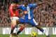 Manchester United's South Korean midfielder Park Ji-Sung (L) vies with Wigan Athletic's Ivorian defender Steve Gohouri during the English Premier League football match between Manchester United and Wigan Athletic at Old Trafford in Manchester, north-west England on November 20, 2010. AFP PHOTO/ANDREW YATES FOR EDITORIAL USE Additional licence required for any commercial/promotional use or use on TV or internet (except identical online version of newspaper) of Premier League/Football League photos. Tel DataCo +44 207 2981656. Do not alter/modify photo (Photo credit should read ANDREW YATES/AFP/Getty Images)