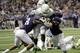Oregon running back Royce Freeman (21) drives between TCU defenders Nick Orr (18) and Ty Summers (42) to score a touchdown during the first half of the Alamo Bowl NCAA college football game Saturday, Jan. 2, 2016, in San Antonio. (AP Photo/Eric Gay)