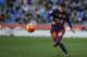 Barcelona's Lionel Messi kicks the ball during a Spanish La Liga soccer match against Espanyol at Cornella-El Prat stadium in Cornella Llobregat, Barcelona, Spain, Saturday, Jan. 2, 2016. (AP Photo/Emilio Morenatti)