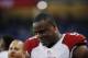 Arizona Cardinals defensive end Cory Redding (90) walks in the bench area during the first half of an NFL football game against the Detroit Lions, Sunday, Oct. 11, 2015, in Detroit. (AP Photo/Paul Sancya)