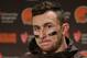 Cleveland Browns quarterback Johnny Manziel speaks with media members following the team's 30-13 loss to the Seattle Seahawks n an NFL football game, Sunday, Dec. 20, 2015, in Seattle. (AP Photo/Scott Eklund)