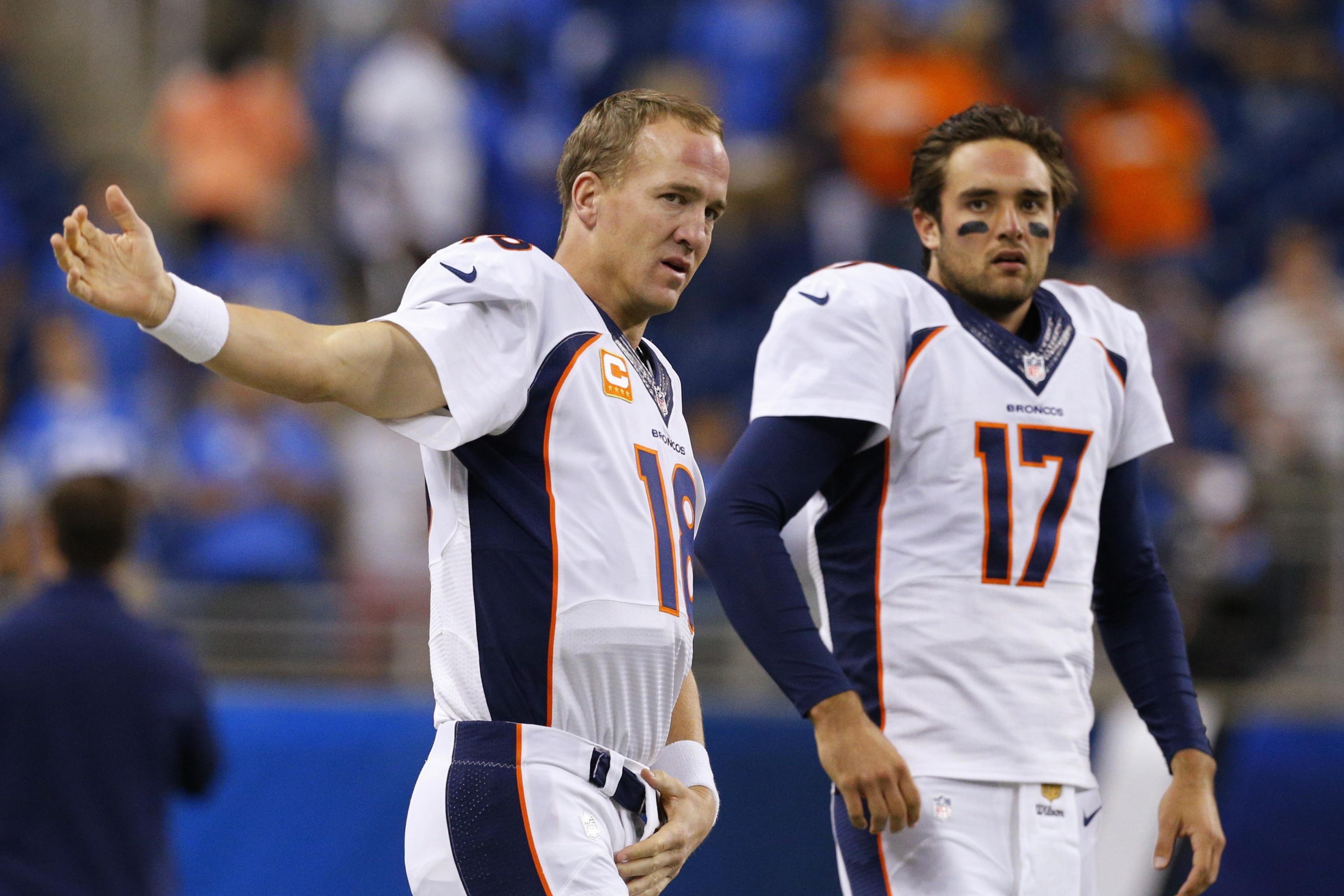 Denver Broncos quarterback Peyton Manning, left, and Denver