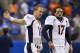 FILE - In this Sept. 27, 2015, file photo, Denver Broncos quarterbacks Peyton Manning (18) and Brock Osweiler (17) get ready for the Broncos' NFL football game against the Detroit Lions in Detroit. Osweiler gets his first NFL start in his fourth pro season, on Sunday against the Chicago Bears. Manning promises not to