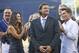 Former San Diego Padres pitcher Trevor Hoffman stands between his wife, Tracy, and one of his sons as he looks at a standing ovation by fans during his induction into the Padres' Hall-of-Fame Saturday, Aug. 30, 2014, in San Diego. (AP Photo/Lenny Ignelzi)