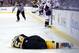 Jan 5, 2016; Boston, MA, USA; Boston Bruins defenseman Adam McQuaid (54) lies on the ice after being checked into the boards by Washington Capitals center Zach Sill (not pictured) during the second period at TD Garden. Mandatory Credit: Greg M. Cooper-USA TODAY Sports