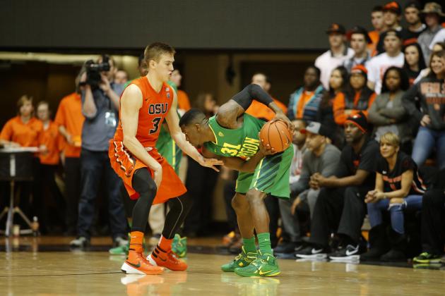 Oregon State's Tres Tinkle (3) and  Oregon's Dylan Ennis (31) in the second half of an NCAA college basketball game, in Corvallis, Ore., on Sunday, Jan. 3, 2016. (AP Photo/Timothy J. Gonzalez)