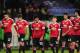 TOPSHOT - Manchester United's players look dejected as they leave the pitch after the UEFA Champions League Group B second-leg football match VfL Wolfsburg vs Manchester United in Wolfsburg, central Germany, on December 8, 2015. / AFP / JOHN MACDOUGALL (Photo credit should read JOHN MACDOUGALL/AFP/Getty Images)