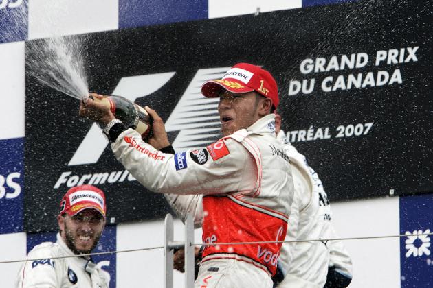 Montreal, CANADA: McLaren Mercedes driver Lewis Hamilton (R) of Britain celebrates winning the Formula One Grand Prix of Canada 10 June 2007 in Montreal, Canada, the first win of his Formula One career, with second place finisher BMW Sauber driver Nick Heidfeld (L) of Germany. Williams driver Alexander Wurz of Austria finished thrid.  AFP PHOTO/Stan HONDA (Photo credit should read STAN HONDA/AFP/Getty Images)