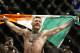 Conor McGregor reacts after defeating Jose Aldo during a featherweight championship mixed martial arts bout at UFC 194, Saturday, Dec. 12, 2015, in Las Vegas. (AP Photo/John Locher)
