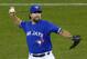 Toronto Blue Jays starting pitcher R.A. Dickey throws against the Kansas City Royals during the first inning in Game 4 of baseball's American League Championship Series on Tuesday, Oct. 20, 2015, in Toronto. (AP Photo/Paul Sancya)