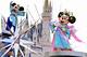 TOKYO, JAPAN: (FILES) Dated 01 July 2004 filed photo shows Mickey and Minnie Mouse, who play Altair the Cowherd and Vega the Weaver, wave to spectators from the float to celebrate Tanabata or the Star Festival at the Tokyo Disneyland. Asia already hosts half of the world's top 10 most visited parks, with the 10 biggest attractions in the region luring 68 million visitors a year, as report said 18 July, 2004. AFP PHOTO/Yoshikazu TSUNO (Photo credit should read YOSHIKAZU TSUNO/AFP/Getty Images)
