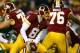LANDOVER, MD - JANUARY 10: Quarterback Kirk Cousins #8 of the Washington Redskins looks to hand off the ball against the Green Bay Packers in the third quarter during the NFC Wild Card Playoff game at FedExField on January 10, 2016 in Landover, Maryland. (Photo by Elsa/Getty Images)
