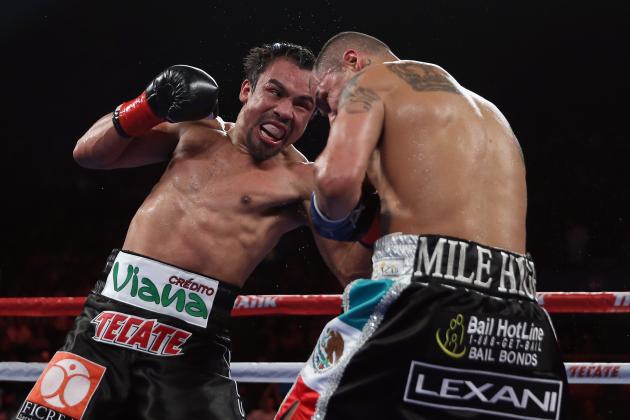 INGLEWOOD, CA - MAY 17:  Juan Manuel Marquez (L) prepares to throw a right hand at Mike Alvarado at The Forum on May 17, 2014 in Inglewood, California.  (Photo by Jeff Gross/Getty Images)