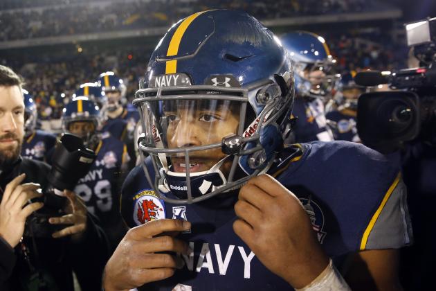 Navy quarterback Keenan Reynolds walks on the field after the Military Bowl NCAA college football game against Pittsburgh, Monday, Dec. 28, 2015, in Annapolis, Md. (AP Photo/Patrick Semansky)