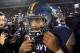 Navy quarterback Keenan Reynolds walks on the field after the Military Bowl NCAA college football game against Pittsburgh, Monday, Dec. 28, 2015, in Annapolis, Md. (AP Photo/Patrick Semansky)