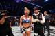 Holly Holm with her coach, Mike Winkeljohn, after winning the UFC Bantamweight Championship.