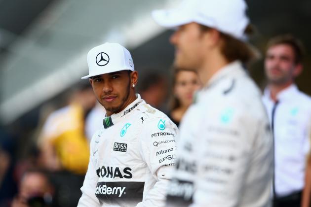 ABU DHABI, UNITED ARAB EMIRATES - NOVEMBER 29:  Lewis Hamilton of Great Britain and Mercedes GP and Nico Rosberg of Germany and Mercedes GP take part in the team photograph in the pit lane before the Abu Dhabi Formula One Grand Prix at Yas Marina Circuit on November 29, 2015 in Abu Dhabi, United Arab Emirates.  (Photo by Clive Mason/Getty Images)