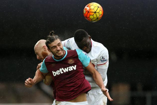 Liverpool's Zaire-born Belgian striker Christian Benteke (R) vies with West Ham United's Welsh defender James Collins and West Ham United's English striker Andy Carroll (C) during the English Premier League football match between West Ham United and Liverpool at The Boleyn Ground in Upton Park, East London on January 2, 2016. West Ham won the game 2-0. AFP PHOTO / JUSTIN TALLIS

RESTRICTED TO EDITORIAL USE. No use with unauthorized audio, video, data, fixture lists, club/league logos or 'live' services. Online in-match use limited to 75 images, no video emulation. No use in betting, games or single club/league/player publications. / AFP / JUSTIN TALLIS        (Photo credit should read JUSTIN TALLIS/AFP/Getty Images)