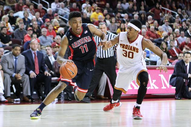 LOS ANGELES, CA - JANUARY 09:  Allonzo Trier #11 of the Arizona Wildcats handles the ball against Elijah Stewart #30 of the USC Trojans in a USC 4OT win 101-103 during a NCAA Pac12 college basketball game at Galen Center on January 9, 2016 in Los Angeles, California.  (Photo by Leon Bennett/Getty Images)
