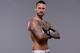 DALLAS, TX - MARCH 13: Phil 'CM Punk' Brooks poses for a photo during a UFC photo session at the Hilton Anatole Hotel on March 13, 2015 in Dallas, Texas. (Photo by Mike Roach/Zuffa LLC/Zuffa LLC via Getty Images)
