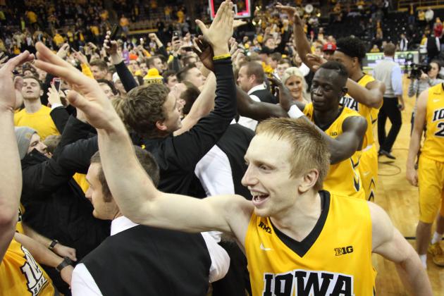 IOWA CITY, IA - DECEMBER 29:  Guard Mike Gesell #10 of the Iowa Hawkeyes celebrates with fans who stormed the court after defeating the Michigan State Spartans on December 29, 2015 at Carver-Hawkeye Arena, in Iowa City, Iowa.  (Photo by Matthew Holst/Getty Images)