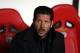 Atletico's coach Diego Simeone is seen before the Champions League group C soccer match between Benfica and Atletico Madrid at the Luz stadium in Lisbon, Tuesday, Dec. 8, 2015. (AP Photo/Armando Franca)