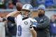 FILE - In this Dec. 21, 2014, file photo, Detroit Lions quarterback Matthew Stafford warms up as coach Jim Caldwell watches before an NFL football game against the Chicago Bears in Chicago. The Bears and the Lions meet again on Sunday, Jan. 3. (AP Photo/Charles Rex Arbogast, File)