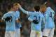 Manchester City's Spanish midfielder David Silva (3R) celebrates with teammates Manchester City's Argentinian striker Sergio Aguero, Manchester City's Belgian midfielder Kevin De Bruyne and Manchester City's Ivorian midfielder and captain Yaya Toure during the English Premier League football match between Manchester City and Crystal Palace at the Etihad Stadium in Manchester, north west England, on January 16, 2016. AFP PHOTO / PAUL ELLIS
RESTRICTED TO EDITORIAL USE. No use with unauthorized audio, video, data, fixture lists, club/league logos or 'live' services. Online in-match use limited to 75 images, no video emulation. No use in betting, games or single club/league/player publications. / AFP / PAUL ELLIS (Photo credit should read PAUL ELLIS/AFP/Getty Images)