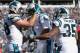 CHARLOTTE, NC - JANUARY 17: Cam Newton #1, Greg Olsen #88, and Mike Tolbert #35 of the Carolina Panthers celebrate after a touchdown against the Seattle Seahawks in the 2nd quarter during the NFC Divisional Playoff Game at Bank of America Stadium on January 17, 2016 in Charlotte, North Carolina. (Photo by Streeter Lecka/Getty Images)