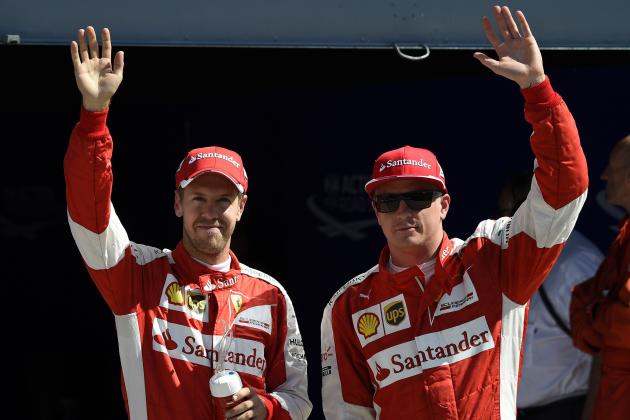 (LtoR) Third placed Ferrari's German driver Sebastian Vettel and second placed Ferrari's Finnish driver Kimi Raikkonen celebrate after the qualifying session at the Autodromo Nazionale circuit in Monza on September 5, 2015 ahead of the Italian Formula One Grand Prix.  AFP PHOTO / OLIVIER MORIN        (Photo credit should read OLIVIER MORIN/AFP/Getty Images)
