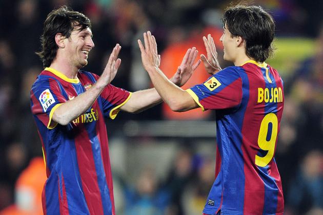 Barcelona's forward Bojan Krkic (R) celebrates with his team-mate Barcelona's Argentinian forward Lionel Messi (L) after scoring against Real Sociedad during their Spanish league football match at the Camp Nou stadium in Barcelona on December 12, 2010. FC Barcelona won 5-0. AFP PHOTO/ JOSEP LAGO (Photo credit should read JOSEP LAGO/AFP/Getty Images)