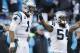 Carolina Panthers outside linebacker Shaq Green-Thompson (54) and Carolina Panthers quarterback Cam Newton (1) celebrate after the second half of an NFL divisional playoff football game against the Seattle Seahawks, Sunday, Jan. 17, 2016, in Charlotte, N.C. The Panthers won 31-24. (AP Photo/Bob Leverone)