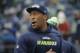 Seattle Seahawks' Bruce Irvin walks on the field before an NFL football game against the Pittsburgh Steelers, Sunday, Nov. 29, 2015, in Seattle. (AP Photo/Ted S. Warren)