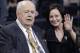 FILE - In this Oct. 26, 2014, file photo, New Orleans Saints owner Tom Benson sits on the sideline with his wife Gayle Benson before an NFL football game against the Green Bay Packers in New Orleans. Tom Benson, who owns the Saints and NBA's Pelicans, asserted in a statement released Thursday, Jan. 22, 2015, that removing his daughter and grandchildren from the operation of his sports franchises _ and inserting his wife of 10 years in their place _ will ensure the clubs’ long-term stability and future in New Orleans. (AP Photo/Bill Haber, File)