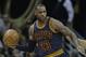 Cleveland Cavaliers' LeBron James, left, drives past Golden State Warriors’ Stephen Curry in the second half of an NBA basketball game, Monday, Jan. 18, 2016, in Cleveland. The Warriors won 132-98. (AP Photo/Tony Dejak)
